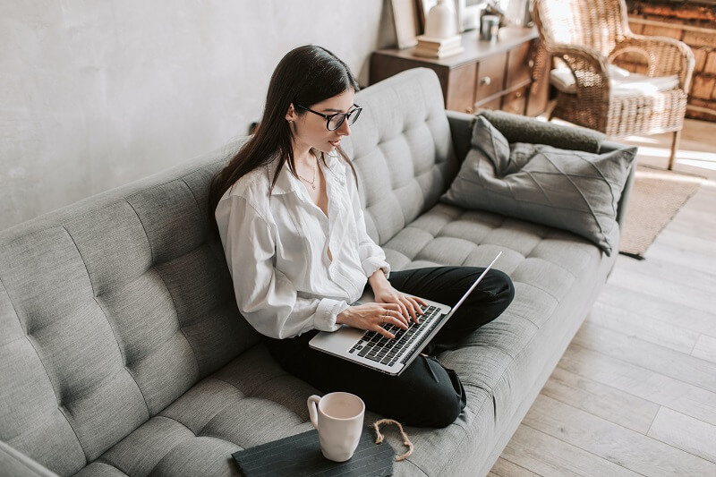 Woman working on laptop at home